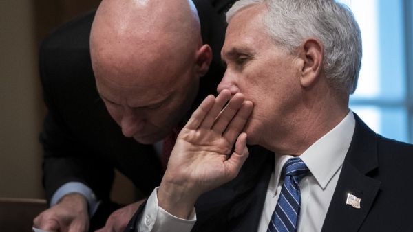 In this file photo taken on March 2, 2020 US Vice President Mike Pence and his chief of staff Mark Short confer during a meeting with the White House Coronavirus Task Force and pharmaceutical executives in Cabinet Room of the White House in Washington, DC. US Vice President Mike Pence's chief of staff tested positive for Covid-19 on October 24, a spokesman said, the latest in a list of figures connected to Donald Trump's administration to do so. Drew Angerer / GETTY IMAGES NORTH AMERICA / AFP