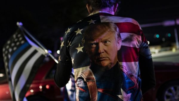 Supporters of U.S. President Donald Trump rally outside Walter Reed National Military Medical Center on October 3, 2020 in Bethesda, Maryland. Trump arrived at the hospital yesterday after testing positive for COVID-19. Alex Edelman/Getty Images/AFP Alex Edelman / GETTY IMAGES NORTH AMERICA / Getty Images via AFP