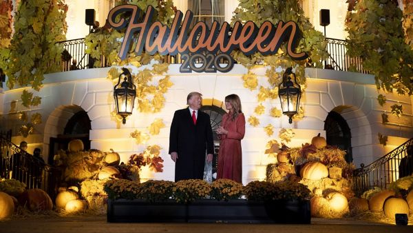 President Donald Trump and First Lady Melania Trump great guests on the south lawn of the White House on October 25, 2020 in Washington, DC. To ensure the health and safety of guests and staff during the Halloween festivities, extra measures such as facemasks, social distancing, and hand-sanitizer were put in place. Tasos Katopodis/Getty Images/AFP TASOS KATOPODIS / GETTY IMAGES NORTH AMERICA / Getty Images via AFP