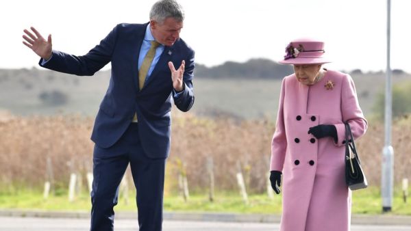 Britain's Queen Elizabeth II (C) speaks with Dstl Chief Executive Gary Aitkenhead (L) as she arrives at the Energetics Analysis Centre as they visit the Defence Science and Technology Laboratory (Dstl) at Porton Down science park near Salisbury, southern England, on October 15, 2020. The Queen and the Duke of Cambridge visited the Defence Science and Technology Laboratory (Dstl) where they were to view displays of weaponry and tactics used in counter intelligence, a demonstration of a Forensic Explosives In