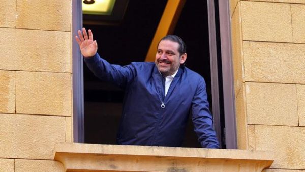 Lebanese Former Prime Minister Saad Al Hariri greets his supporters upon his arrival at his home in Beirut on Wednesday (AFP photo)
