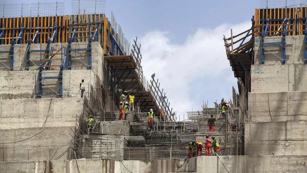 Workers are photographed at the Grand Ethiopian Renaissance Dam (GERD), near Guba in Ethiopia. AFP