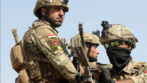 Iraqs rapid response forces storm a house in the Tarmiyah district, north of Baghdad, searching for wanted Islamic State group suspects on July 21, 2019. (Ahmad al-Rubaye/AFP via Getty Images)