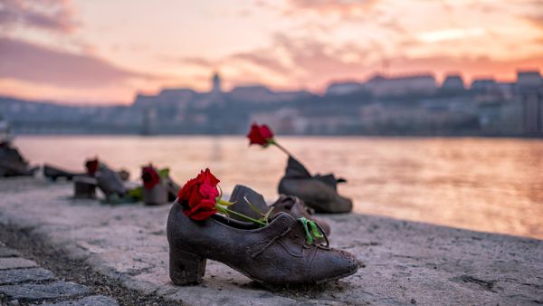 "Shoes on the Danube bank" - Monument as a memorial of the victims of the Holocaust during WWII on the bank of the Danube at sunset in Budapest, Hungary  (Shutterstock)	  