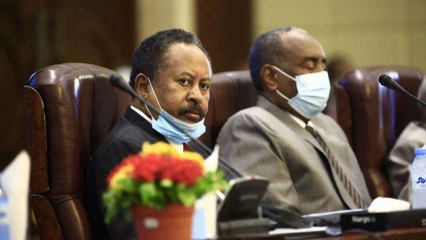 Sudan’s Prime Minister Abdalla Hamdok (left) and Sovereign Council chief General Abdel Fattah al-Burhan attend a conferecne in the capital Khartoum on September 26. (AFP)