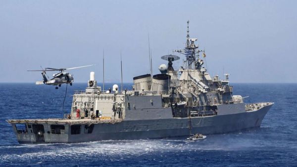Greek Hydra-class frigate Psara (F-454) of the Hellenic Navy and a military helicopter taking part in a military exercise in the eastern Mediterranean Sea, on August 25. (AFP)