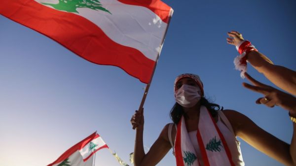 Hundreds marched in Lebanon's capital to mark the first anniversary of a non-sectarian protest movement that has rocked the political elite but has yet to achieve its goal of sweeping reform. ANWAR AMRO / AFP
