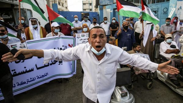 A Palestinian man reacts during a rally to protest against the reduction of the food basket provided by the United Nations Relief and Works Agency for Palestine Refugees in the Near East (UNRWA), in front of the agency's headquarters in the town of Khan Yunis in the Southern Gaza Strip, on October 18, 2020. SAID KHATIB / AFP