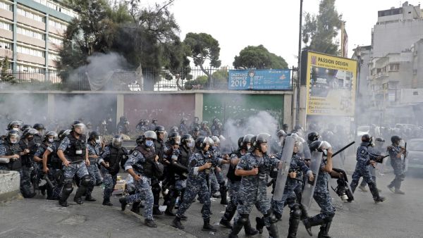 Members of Lebanon's security forces deploy amid clashes with demonstrators at a rally called by an Islamist group to protest comments by the French President seen as offensive to Islam, near the residence of the French Ambassador in the capital Beirut, on October 30, 2020. (AFP)