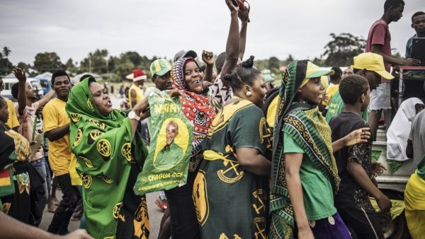 Supporters of the ruling Chama Cha Mapinduzi (Revolutionary Party) celebrate the victory of their candidate in the Zanzibar Presidential election on the outskirts of Stone Town, on October 30, 2020. MARCO LONGARI / AFP