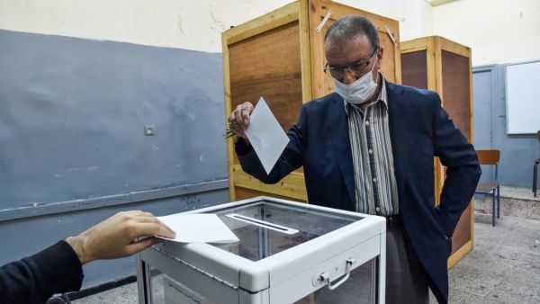 An Algerian man casts his ballot at a polling station in the capital Algiers during a vote for a revised constitution, on November 1, 2020. Polls opened in Algeria today for a vote on a revised constitution the regime hopes will neutralise a protest movement which at its peak last year swept long-time president Abdelaziz Bouteflika from power. RYAD KRAMDI / AFP