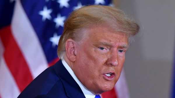 US President Donald Trump leaves after speaking during election night in the East Room of the White House in Washington, DC, early on November 4, 2020. MANDEL NGAN / AFP
