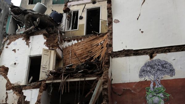 This picture shows a view of a building damaged by the August 4 port blast, in the Lebanese capital Beirut's Gemayzeh neighbourhood on November 5, 2020. Beirut's August 4 disaster, which authorities say was caused when a huge stockpile of ammonim nitrate fertiliser caught fire years after it was impounded at the port, killed more than 200 people and damaged or destroyed around 70,000 homes. The country's worst peace-time tragedy rendered entire districts unrecognisable. Now winter rains are adding to the de