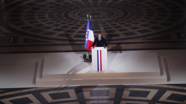 French President Emmanuel Macron delivers his speech by the coffin of late French author Maurice Genevoix who will be inducted to the Pantheon mausoleum where key figures from France's history are honoured, in Paris, on November 11, 2020, as part of the commemorations marking the 102nd anniversary of the November 11, 1918 Armistice, ending World War I (WWI). France on November 11 moves the remains of World War I writer Maurice Genevoix into its Pantheon of national heroes in Paris, an honour championed by t