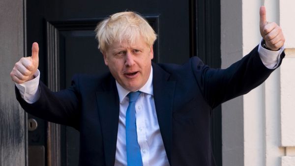 In this file photo taken on July 23, 2019 new Conservative Party leader and incoming prime minister Boris Johnson arrives at the Conservative party headquarters in central London. On July 23, 2019, party members choose Brexit figurehead Boris Johnson as their new leader. He becomes prime minister the next day. Niklas HALLE'N / AFP