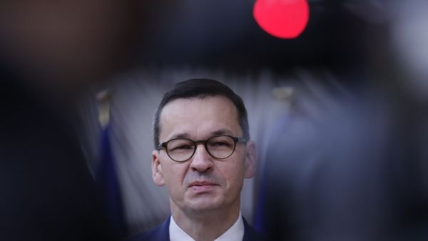  In this file photo taken on October 02, 2020 Poland’s Prime Minister Mateusz Morawiecki arrives on the second day of a European Union (EU) summit at The European Council Building in Brussels. Hungary and Poland blocked approval on November 16, 2020 of the EU's long-term budget and coronavirus rescue -- a 1.8-trillion-euro package -- and plunged the bloc into political crisis. Olivier HOSLET / POOL / AFP