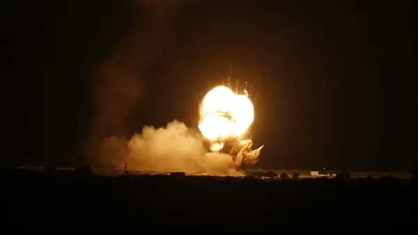 Flames are seen following an Israeli air strike in the town of Khan Yunis, in the southern Gaza Strip, early on November 22, 2020. AFP