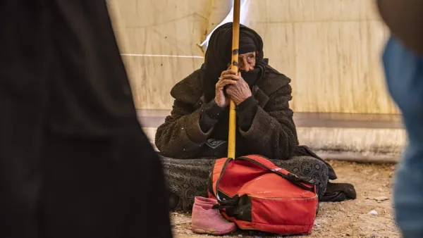 An elderly Syrian woman waits to leave the Kurdish-run al-Hol camp holding relatives of alleged Islamic State (IS) group fighters, in the al-Hasakeh governorate in northeastern Syria, on November 24, 2020. AFP
