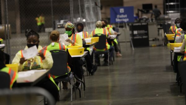 Election workers count ballots on November 03, 2020 in Philadelphia, Pennsylvania. After a record-breaking early voting turnout, Americans headed to the polls today on the last day to cast their vote for incumbent U.S. President Donald Trump or Democratic nominee Joe Biden in the 2020 presidential election. Spencer Platt/Getty Images/AFP SPENCER PLATT / GETTY IMAGES NORTH AMERICA / Getty Images via AFP