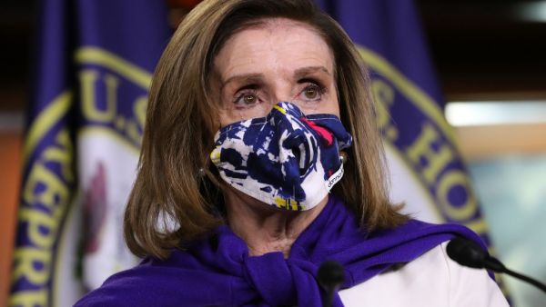  Speaker of the House Nancy Pelosi (D-CA) (C) talks to reporters after she was re-elected to lead her conference at the U.S. Capitol November 18, 2020 in Washington, DC. The conference leadership elections were conducted with some members in-person at a Washington hotel and others joining by Zoom due to the risk posed by the coronavirus pandemic. Chip Somodevilla/Getty Images/AFP CHIP SOMODEVILLA / GETTY IMAGES NORTH AMERICA / Getty Images via AFP