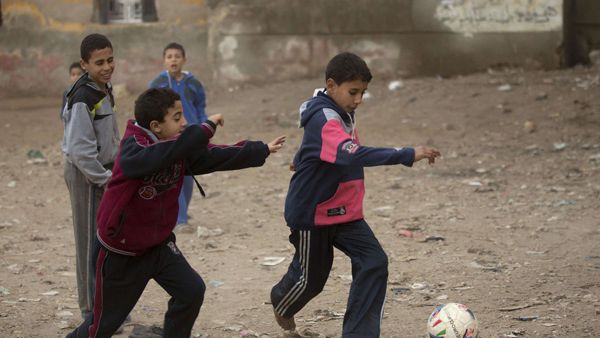 A 2017 file photo shows children playing soccer on an unpaved street in a village near Qalubiyah, north of Cairo, Egypt. (AFP)