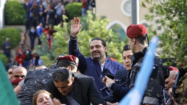 Lebanese prime minister Saad Hariri greets his supporters upon his arrival at his home in Beirut on November 22, 2017. Marwan Tahtah / AFP
