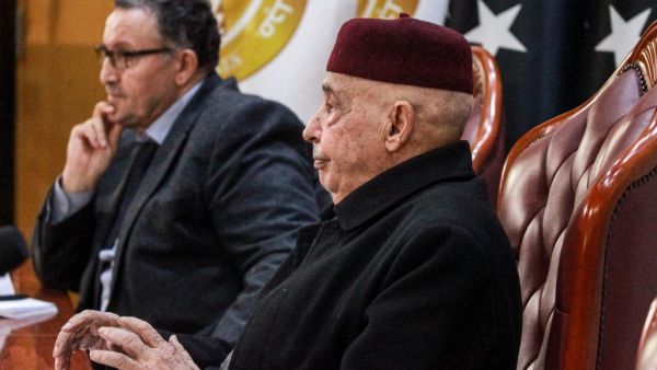 Aguila Saleh Issa (R), speaker of the Tobruk-based Libyan House of Representatives, meets with Ali al-Habri, governor of the parallel Central Bank of Libya based in the east, and with other officials in eastern Benghazi on December 6, 2020. Abdullah DOMA / AFP