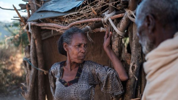 Jano Admasi, whose son was reportedly killed by the Ethiopian Defense Forces during the fightings that broke out in Ethiopia's Tigray region, poses with her husband at her house in the village of Bisober, on December 9, 2020. Tigrayan forces settled in the school several months ago. The November 14 killings represent just one incident of civilian suffering in Bisober, a farming village home to roughly 2,000 people in southern Tigray. In retrospect, Bisober residents say, the first sign of the conflict came 