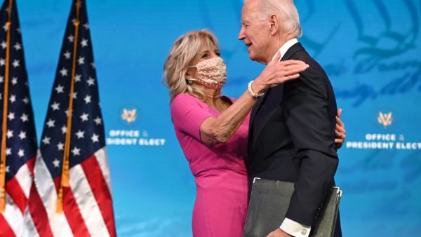 US President-elect Joe Biden arrives with wife Jill Biden to deliver remarks on the Electoral college certification at the Queen Theatre in Wilmington, Delaware on December 14, 2020. ROBERTO SCHMIDT / AFP