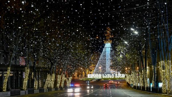 A view of the St. George Monument at Tbilisi's Freedom Square decorated for the upcoming Christmas and New Year holidays during a night-time curfew imposed by the government amid the ongoing coronavirus disease pandemic late on December 17, 2020. Vano Shlamov / AFP