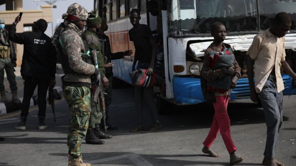 Released students from the Government Science Secondary school, in Kankara, in northwestern Katsina State, Nigeria leave the busses before being led into the Government House upon their release on December 18, 2020. More than 300 Nigerian schoolboys were released on Thursday after being abducted in an attack claimed by Boko Haram, officials said, although it was unclear if any more remained with their captors Kola SULAIMON / AFP