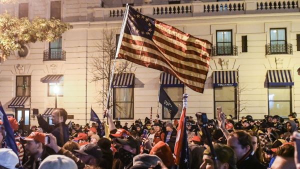 Thousands of protesters who refuse to accept that President-elect Joe Biden won the election are rallying ahead of the electoral college vote to make Trump's 306-to-232 loss official. Stephanie Keith/Getty Images/AFP