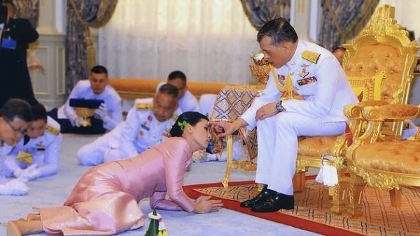 Thailand's King Maha Vajiralongkorn and Queen Suthida during their wedding ceremony in Bangkok in May last year. According to tradition, the King has a semi-divine status and must be seated higher than those around him. (AFP)