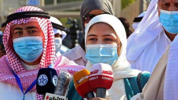 Candidate for the upcoming Kuwaiti parliamentary election Khadija al-Qallaf talks to reporters at the Department of Elections in Kuwait City on the first day of candidate registration. (AFP)