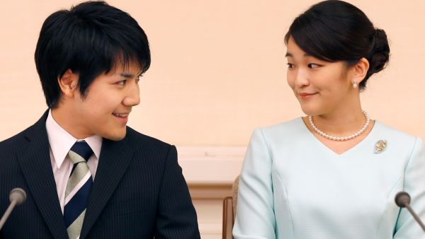Princess Mako, right, and her fiancee Kei Komuro. Shizuo Kambayashi / AFP