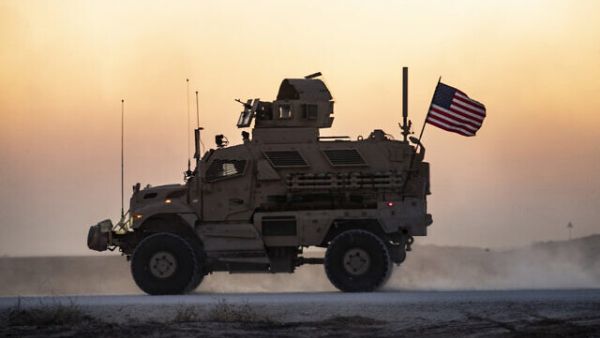 A US military vehicle, part of a convoy, drives near the town of Tal Tamr in the northeastern Syrian Hasakeh province on the border with Turkey, November 10, 2019. (Delil Souleiman/AFP)