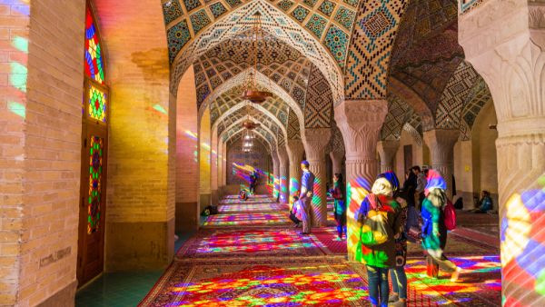 Lot of tourists taking photos in the interior of Nasir Al-Mulk Mosque (Pink Mosque) with colorful shining stained glass windows. (Shutterstock/ File Photo)
