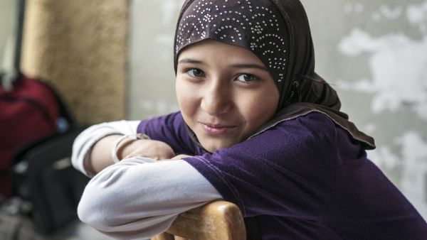  Syrian refugee girl at a camp in Passau, Germany  (Shutterstock)	