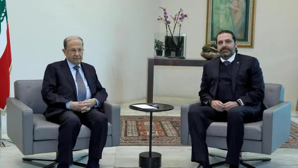 A handout picture provided by the Lebanese photo agency Dalati and Nohra on December 19, 2019 shows Lebanese President Michel Aoun (L) meeting with caretaker Prime Minister Saad Hariri at the presidential palace in Baabda, east of Beirut. AFP