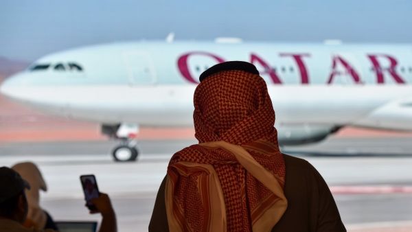 Journalists watch the arrival of the Qatar envoy ahead of the 41st Gulf Cooperation Council (GCC) summit in the city of al-Ula in northwestern Saudi Arabia on January 5, 2021. 