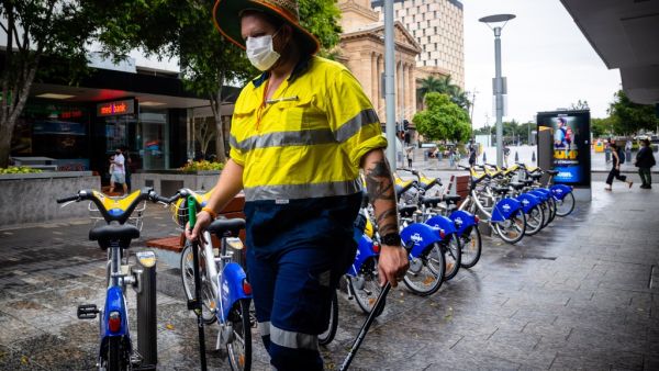 A Brisbane City Council worker wears a mask along the Queen Street Mall in Brisbane on January 8, 2021, as Australia's third-largest city headed into lockdown and borders set to tighten nationwide after a cleaner at a quarantine hotel contracted the UK coronavirus strain that appears to be more infectious. Patrick HAMILTON / AFP A Brisbane City Council worker wears a mask along the Queen Street Mall in Brisbane on January 8, 2021, as Australia's third-largest city headed into lockdown and borders set to tighten nationwide after a cleaner at a quarantine hotel contracted the UK coronavirus strain that appears to be more infectious. Patrick HAMILTON / AFP