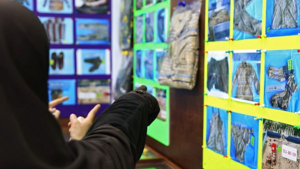 Libyans checking for news of loved ones check belongings of people found in mass graves around Tarhuna, about 80 kilometres (50 miles) from the capital Tripoli, in June last year, on January 11, 2021 at the forensic medicine department in Tripoli Medical Center. Human Rights Watch appealed to Libya's internationally recognised government to launch an investigation aimed at identifying hundreds of people reported missing in a western town where mass graves have been unearthed.  AFP