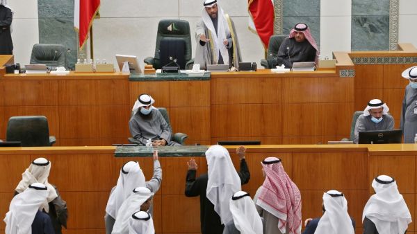 Kuwaiti MPs speak with parliament speaker Marzouq al-Ghanim (Top-C) after the national assembly session was adjourned due to cabinet's resignation, in Kuwait City on January 19, 2021. YASSER AL-ZAYYAT / AFP