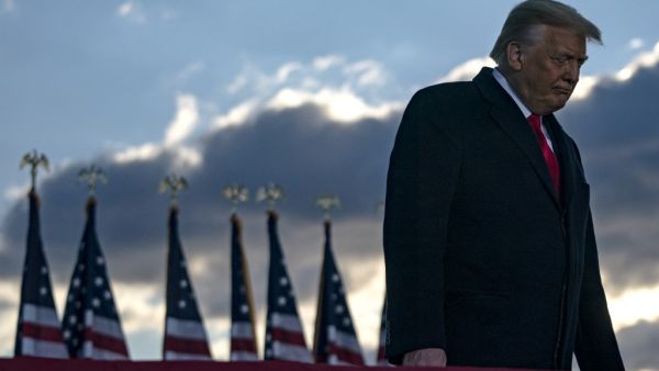 Outgoing US President Donald Trump addresses guests at Joint Base Andrews in Maryland on January 20, 2021. President Trump and the First Lady travel to their Mar-a-Lago golf club residence in Palm Beach, Florida, and will not attend the inauguration for President-elect Joe Biden. ALEX EDELMAN / AFP