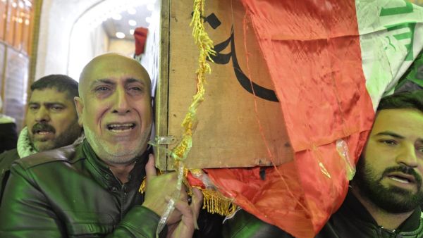Iraqi mourners carry the coffin of a victim who was killed in a twin suicide bombing in central Baghdad, during a funeral in the holy city of Najaf on January 21, 2021. A rare twin suicide bombing killed 32 people and wounded 110 at a crowded market in central Baghdad, Iraq's government said, the city's deadliest attack in three years. The first attacker drew a crowd at the bustling market in the capital's Tayaran Square by claiming to feel sick, then detonated his explosives belt, the interior ministry sai