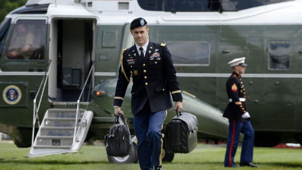 A military aide carries the president's nuclear "football" as President Barack Obama returns to the White House in Washington, DC on May 14, 2016.Olivier Douliery / AFP - Getty Images, file