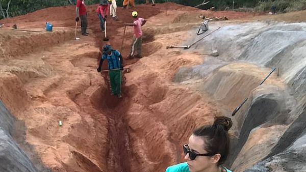The scarlet sculpture, titled 'Diva', stretches for 33 metres and was built into the hillside with the help of diggers. Visual artist Juliana Notari is pictured above. (Instagram)