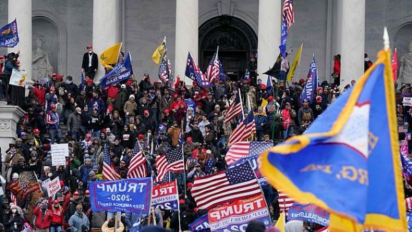 Insurrection: Trump supporters invaded the Capitol on Wednesday shortly after the president had repeated his false claims of election fraud in a fiery speech near the White House. (AFP)