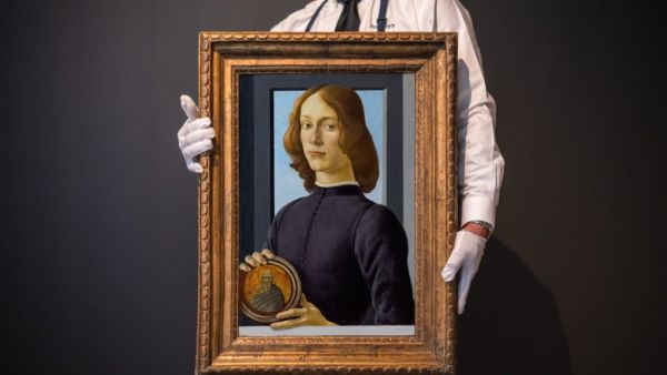 لوحة young man holding a roundel 