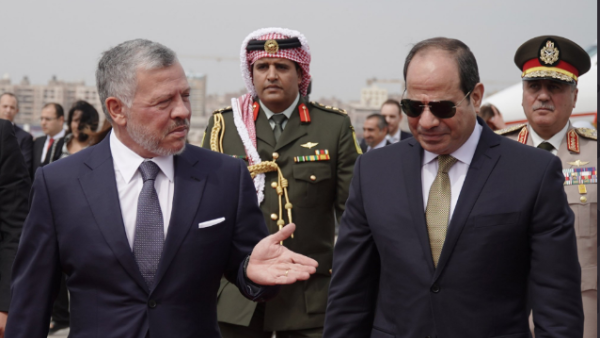 Egyptian President Abdel Fattah El-Sisi, right, is met by Jordan’s King Abdullah on his arrival in Amman. (Twitter/@RHCJO)